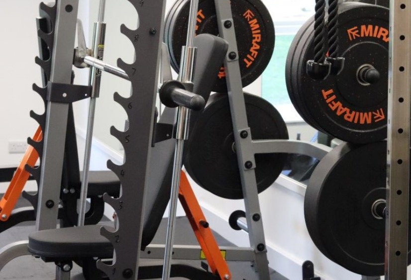 a  weight rack in the new Heath Mount gym